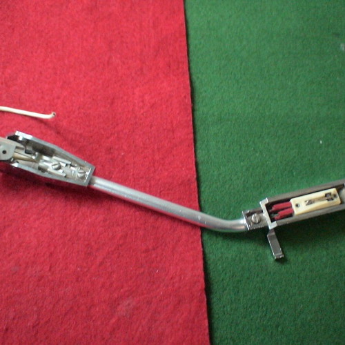 Record player tonearm with head shell and cartridge used, unknown type