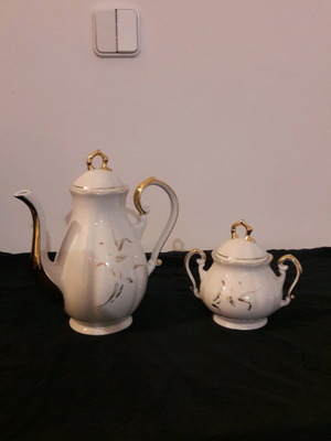 Vintage porcelain teapot and sugar bowl set like new