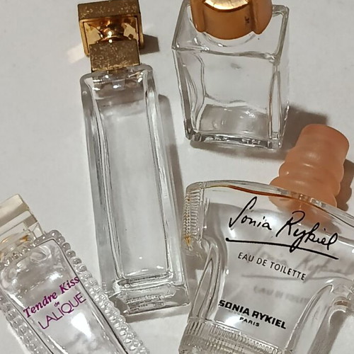 Collection of 29 empty perfume miniatures like new