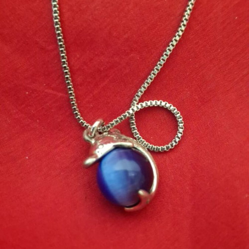 Necklace with dolphin and blue bead used
