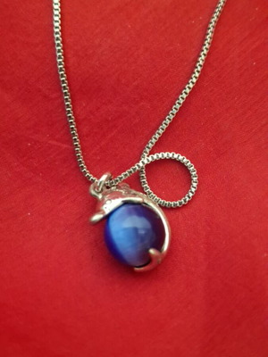 Necklace with dolphin and blue bead used