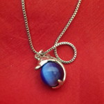 Necklace with dolphin and blue bead used
