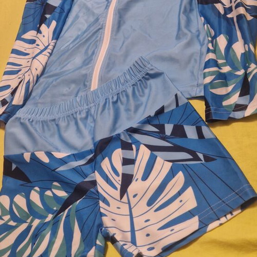 Sun-protective swimwear set with top and bottom, blue and white, size 134 cm