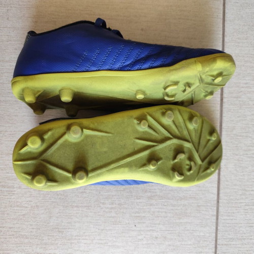 Kipsta kids football shoes used, size 32, blue and yellow