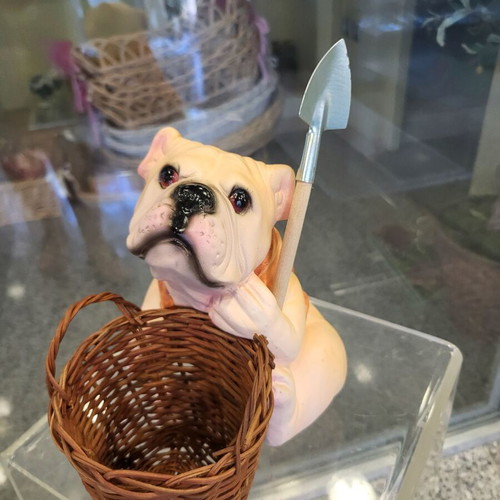 Decorative dog figure with basket