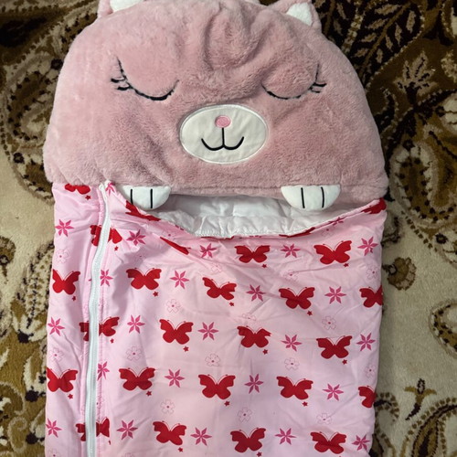 Sleeping bag used, foldable with one button missing