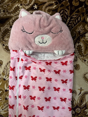 Sleeping bag used, foldable with one button missing