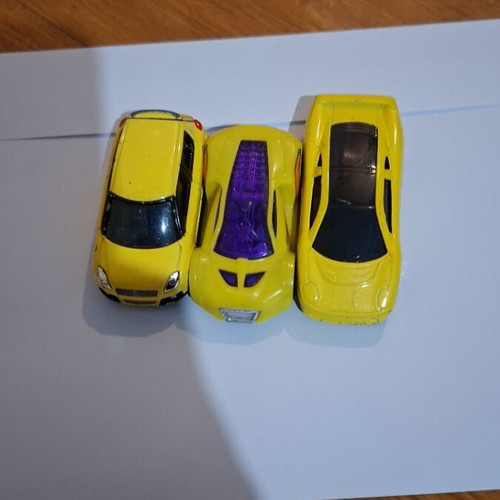 Set of yellow toy cars used