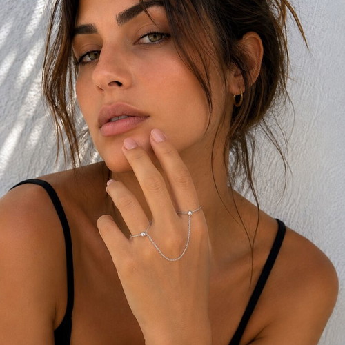 Silver hand chain with rings, modern designer style