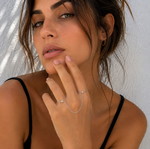 Silver hand chain with rings, modern designer style