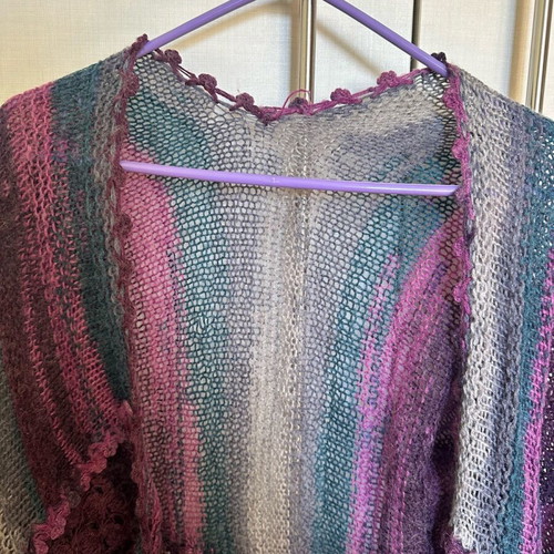 Knitted cardigan like new, multicolored with two patterns