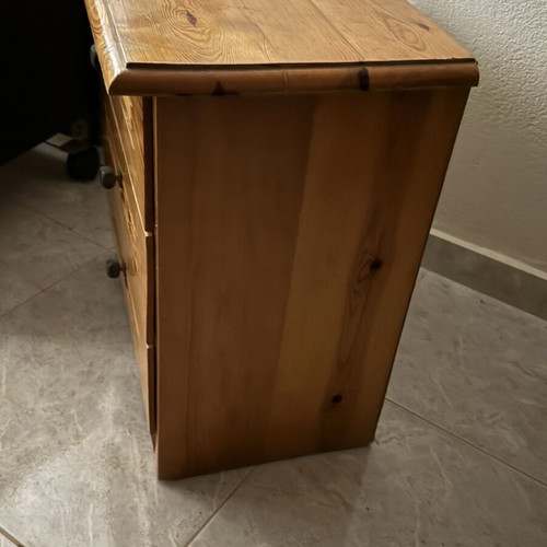 Wooden nightstand used with three drawers, classic design