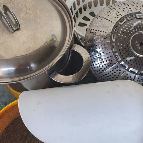 Cookware set used with pot, steamer, sieve, and colander