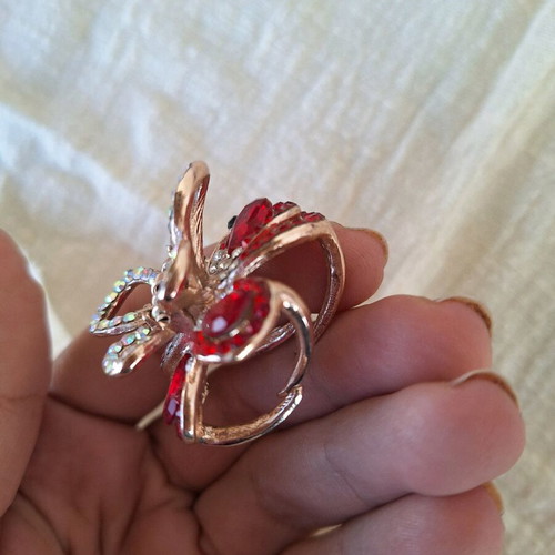 Small butterfly hair clip used with red rhinestones