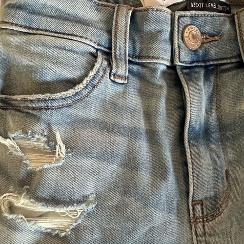 American Eagle stretch jean with rips new size S