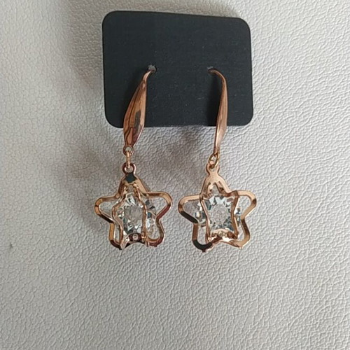 Handmade star earrings in rose gold color, new