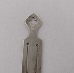 Silver bookmark with cross-shaped handle, used