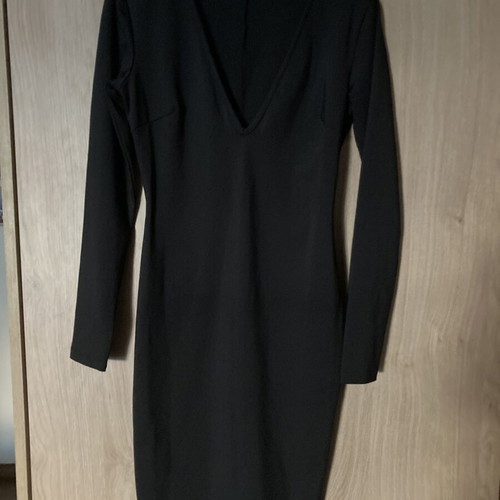 Celestino black fitted dress with deep V neckline like new