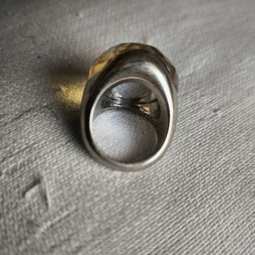 Statement ring with thick honey-colored glass on gold metal, used