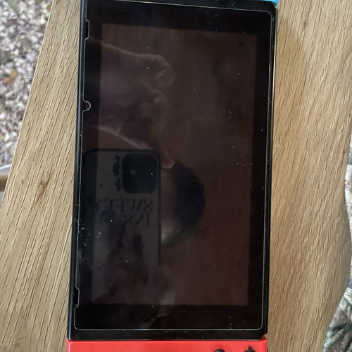 Nintendo Switch console with dock and original Joy-Con