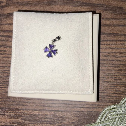 Small purple cross charm like new, no chain