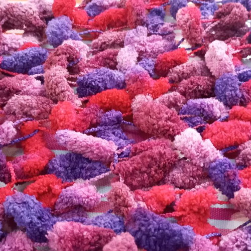 Handmade knitted scarf new with tassels in red and purple tones