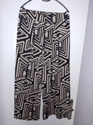 Pants size small medium with geometric patterns, wide comfortable fit, elastic waist, like new