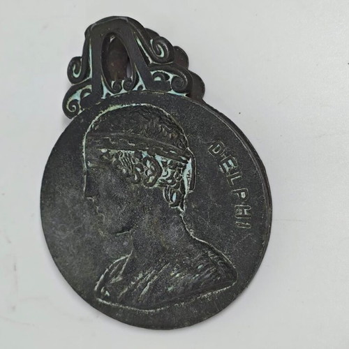 Vintage bronze Delphi paper clip 1947 used