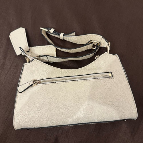 Guess white shoulder bag used with embossed logo pattern