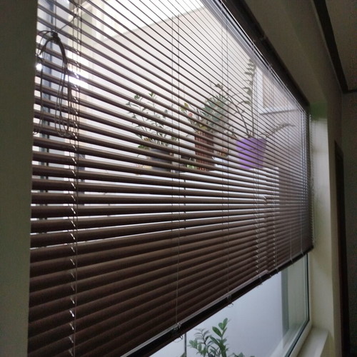 Metal wood-colored roller blind