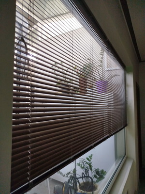 Metal wood-colored roller blind