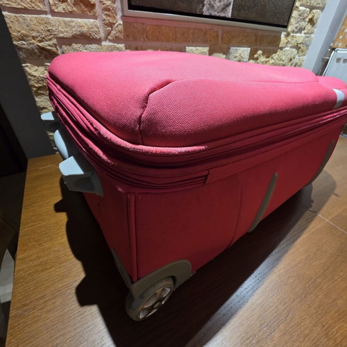 Carpisa 24" travel suitcase used, magenta color, semi-hard fabric