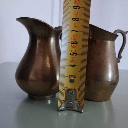 Vintage brass set with jugs, glass, and vase from India