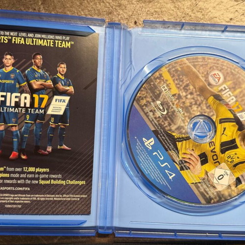 PlayStation 4 Pro used with controller and two games