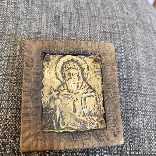Saint Anthony brass icon on wood