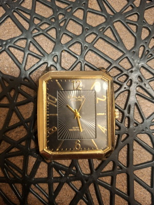 Omax quartz watch gold tone used, large
