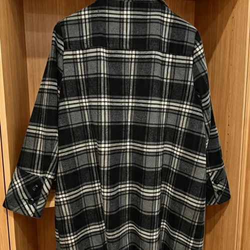 Checked coat with high collar, pockets and buttons