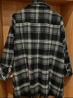 Checked coat with high collar, pockets and buttons