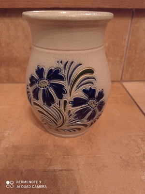Ceramic jug used, beige with embossed design