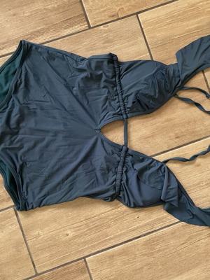 One-piece swimsuit used, white and green, sizes M and L