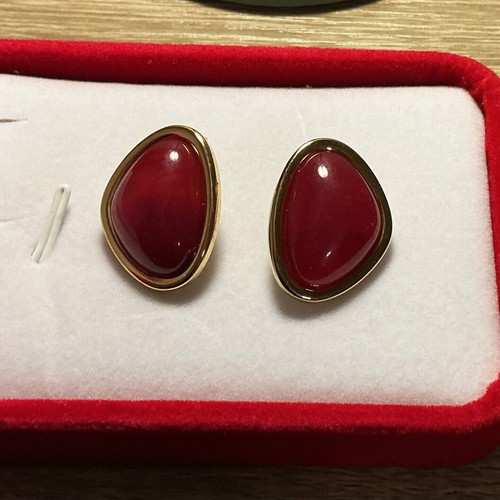 Vintage style earrings with deep red and gold trim