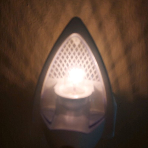 White plug-in night light like new