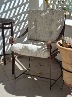 Retro wrought iron garden armchair with cushions used