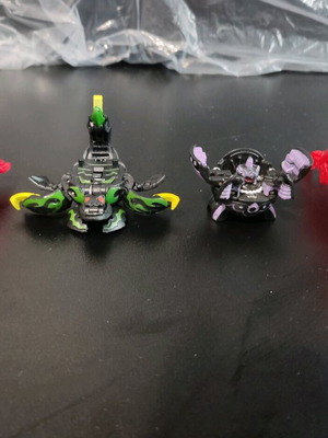 Bakugan figures used, Darkus Olifus, Darkus Fourtress, Red Pyrus Frosch, Hound