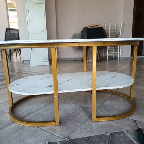 Oval coffee table with marble effect