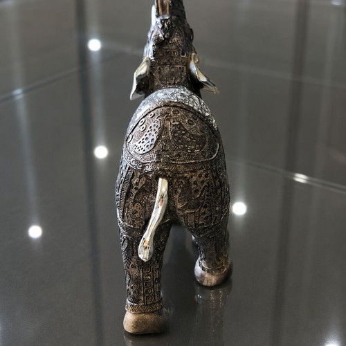 Decorative elephant vintage with embossed Asian-inspired carvings used