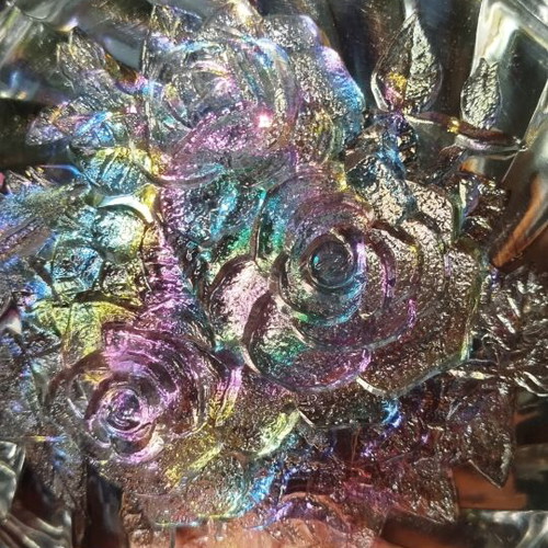 Vintage iridescent glass plate with embossed rose design