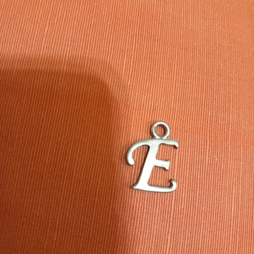 Silver pendant with letter E used