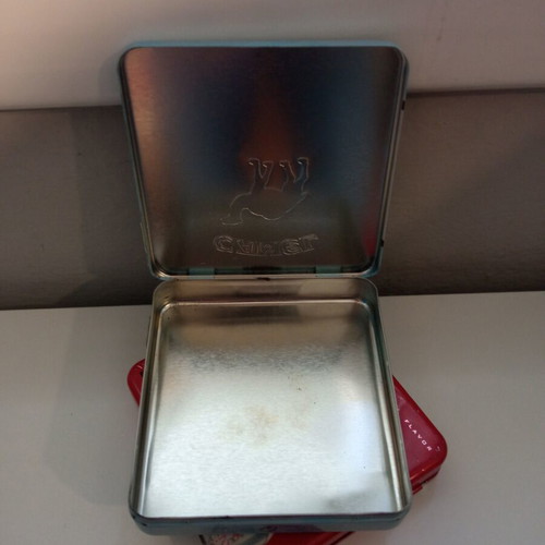 Camel and Winston collectible metal cigarette packs