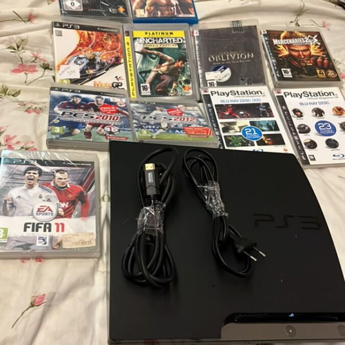 PlayStation 3 Slim console like new with 9 games and 2 demo discs
